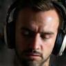 Person listening to headphones